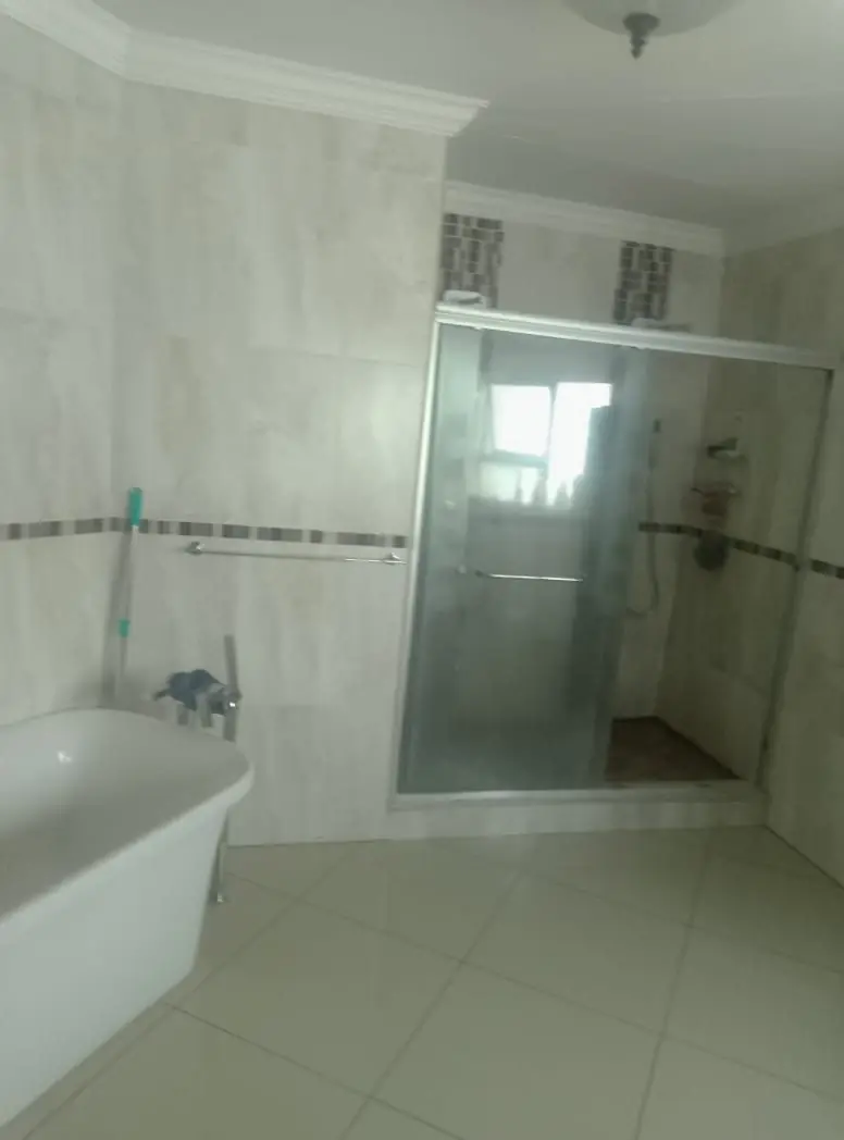 Finished bathroom with bath and shower